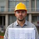 Albion Construction site manager with blueprint on Manchester project