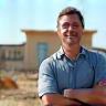 Adam N., local landlord, looking pleased on site