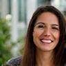 Farah Q., interior designer, smiling inside project office