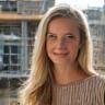 Jessica H., property developer, outdoors in front of project